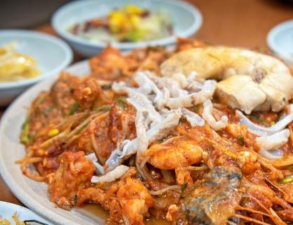 Light and spicy stewed monkfish with seafood in Busan