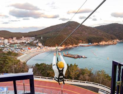 Fly over the sea on a zipline at Taejongdae Cliffed Coast