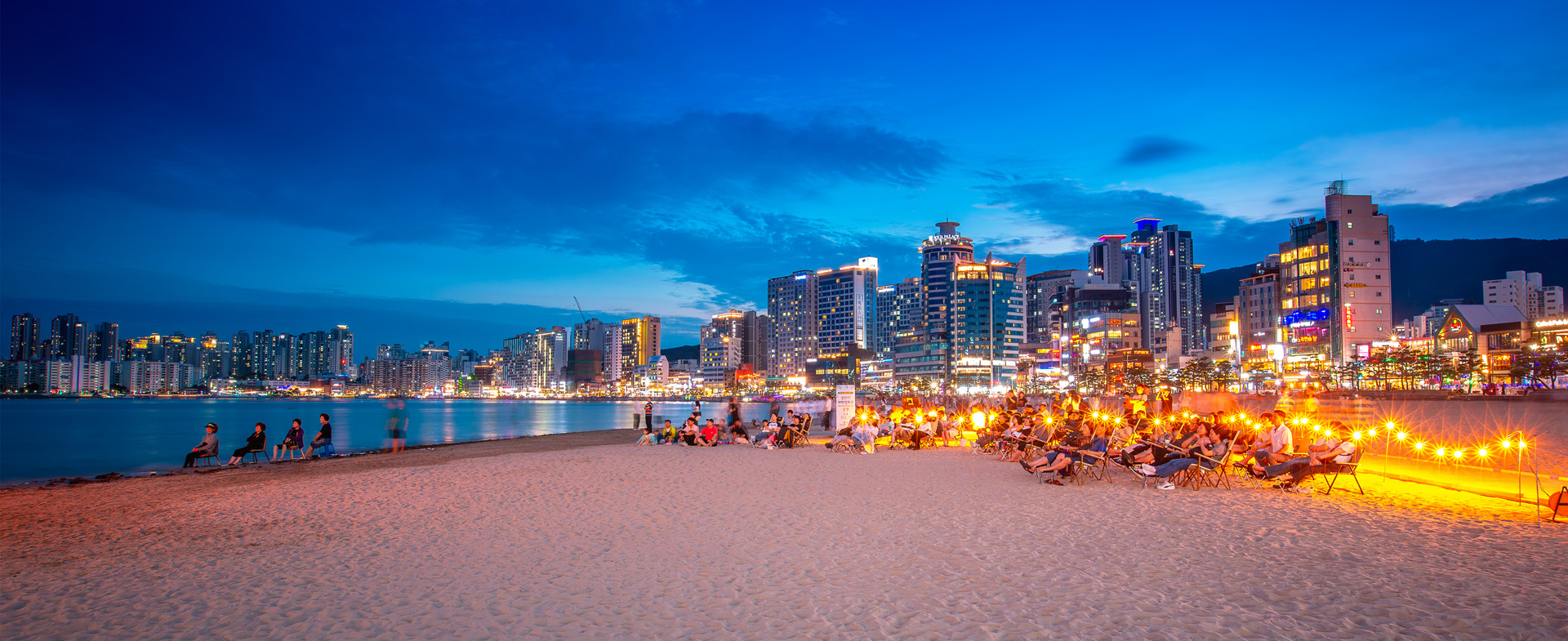 A romantic moment on the sand, Gwangalli Beach Movie Theater